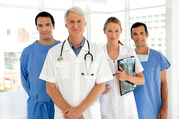 Clinic staff standing together in a bright medical office